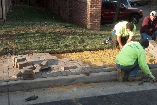 Laying Brick Sidewalk by PSI Employee- Commercial Power Washing Also Available in Washington DC Metro Area